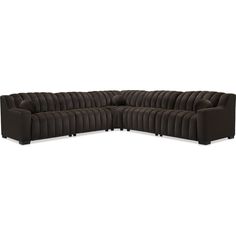 a brown sectional couch with black legs