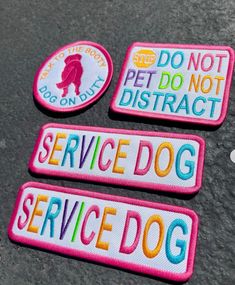 three patches that say service dog and don't pet do not district on them