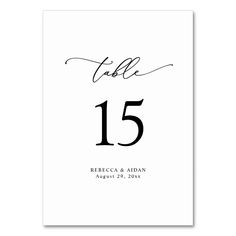 the wedding table numbers are black and white