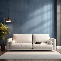 a living room with blue walls and a white couch next to a potted plant