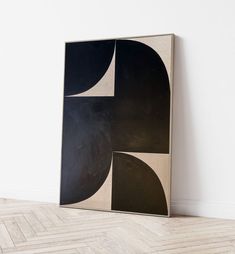 a black and white abstract painting on the wall