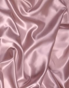 a close up view of a pink satin fabric