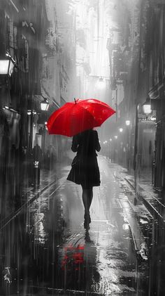 a woman walking in the rain with an umbrella