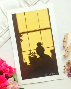 a card with a silhouette of a person sitting at a window sill next to flowers