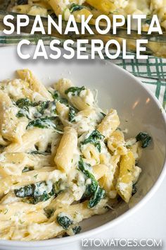 pasta with spinach and cheese in a white bowl