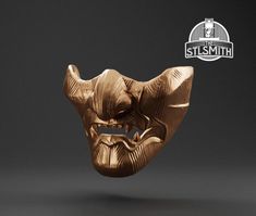 a gold mask with an evil look on it's face and the words still smith above