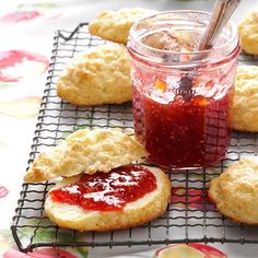 cookies with jam and spoon on cooling rack