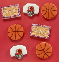 decorated cookies in the shape of basketballs and basketball court