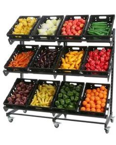 several trays filled with different types of fruits and vegetables on top of each other