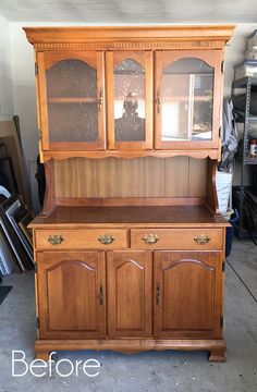 an old china cabinet is being refinished with new paint and wood trimming