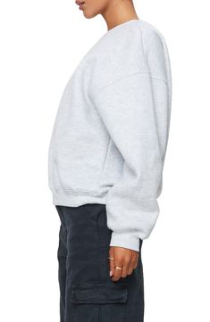 This cozy cotton-kissed sweatshirt is designed in a slouchy silhouette with dropped shoulders. Crewneck Dropped shoulders Ribbed cuffs and hem 65% polyester, 35% cotton Machine wash, dry flat Imported Basic Drop Shoulder Sweats For Fall, Oversized Cotton Crew Neck Sweater, Oversized Cotton Crew Sweater, Relaxed Fit Sweatshirt With Ribbed Collar And Drop Shoulder, Casual Slouchy Crew Neck Sweatshirt, Relaxed Fit Top With Ribbed Collar In French Terry, Boxy Fit Cotton Sweater With Drop Shoulder, Basic Boxy Fit Sweatshirt For Fall, Boxy Fit Cotton Crew Sweatshirt