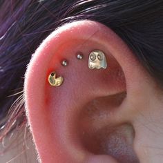 an ear with two little smiley faces on it