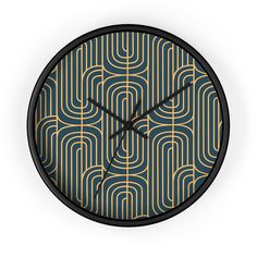 a wall clock with an art deco design on it