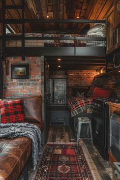 a living room filled with furniture next to a brick wall and wooden floored ceiling