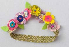 a headband with flowers and leaves on it