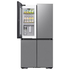 a silver refrigerator freezer sitting inside of it's side door open on a white background