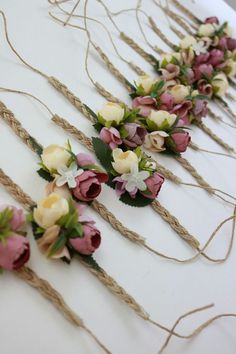 flowers are tied together with twine on the table