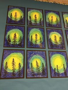 six paintings are displayed on the wall in front of a blue background with green and yellow trees