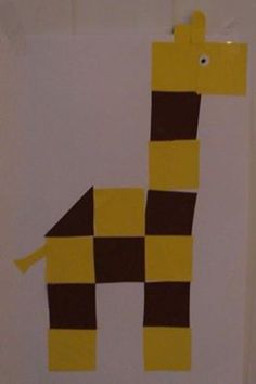 a giraffe made out of construction paper