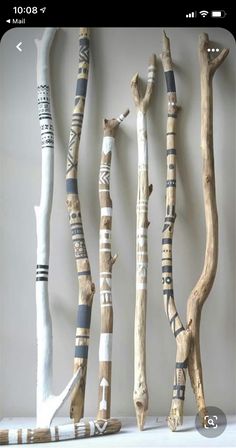 several pieces of art made out of wood sticks