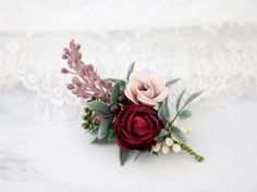 a close up of a flower on a white surface