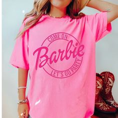 New Barbie Graphic Tee Perfect For The New Barbie Movie And Barbie Lovers!!! Sizes: S-5x Short Sleeves 100% Cotton Perfect For All Barbie Lovers! Barbie T Shirt Ideas, Pink Crew Neck Summer Shirt, Pink Crew Neck Shirt For Summer, Pink Letter Print Top For Party, Pink Letter Print Party Top, Pink Funny Print Crew Neck T-shirt, Pink Short Sleeve Graphic Tee, Pink Crew Neck T-shirt With Funny Print, Pink Fun Crew Neck Top