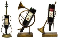 three musical instruments and a bottle of wine are shown in this image, one is brass