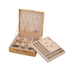 an open wooden box with jewelry in it