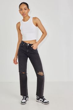 Compliment any vibe with this timeless high-rise style. These semi-fitted, straight leg jeans serve in any situation and come in authentic non-stretch denim. These jeans are straight perfection! Features - Five-pocket styling - Zip fly with button closure - Distressed denim Size & Fit - Fit: Straight - Rise: 10.5" - Inseam: 29" - Model is wearing size 5 Materials & Care - Content: 75% cotton, 25% organic cotton - Care: Wash cold, inside out - Imported Garage Clothing, High Rise Style, Jean Vintage, Black Ripped Jeans, Distressed Black Jeans, Jeans Women, Women Clothes, Vintage Jeans, Ripped Jeans