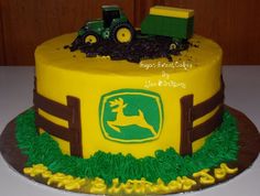 there is a cake that looks like a tractor and farm scene on the top of it