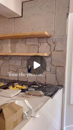 a kitchen counter with some shelves on top of it and the words trust the process