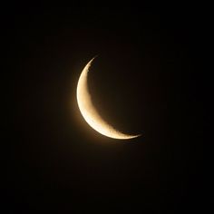 the moon is seen in the dark sky during a partial solar eclipse on march 29, 2013