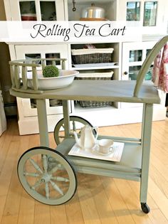 a rolling tea cart in the middle of a kitchen