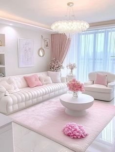 a living room filled with white furniture and pink accents