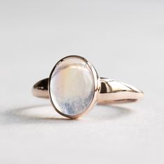 Rainbow moonstone set on 14k Rose gold. Solid 14k rose gold fully hallmarked. 1.4mm band width. 8mmX 10mm Genuine rainbow moonstone All of our jewelry will arrive in custom packaging ready for gift giving. LEAD TIME: Made to order will take 10-14 days. FOLLOW US ON: Instagram: @roseandchoc Facebook: /Roseandchoc Pinterest: @Roseandchoc 14k Gold Oval Cabochon Moonstone Ring, Rose Gold Oval Opal Gemstone Ring, Oval Rose Gold Opal Gemstone Ring, Rose Gold Oval Opal Ring, Timeless Oval Moonstone Ring With Polished Finish, Heirloom Oval Moonstone Ring With Polished Finish, Heirloom Rose Gold Oval Opal Ring, 14k Gold Cabochon Moonstone Promise Ring, Classic Oval Moonstone Ring