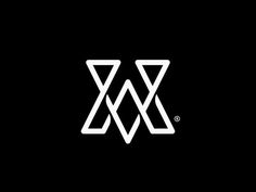 a black and white logo with the letter w in it's center, on a dark background