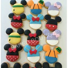 mickey mouse cookies are arranged in the shape of disney's ears and other characters