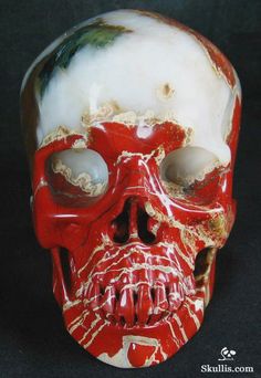 a red and white skull with two holes in it