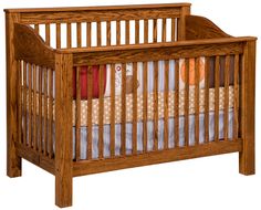 a wooden crib with white sheets on the bottom and green bedding underneath it