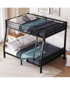 a metal bunk bed with two sets of mattresses on top and one set below