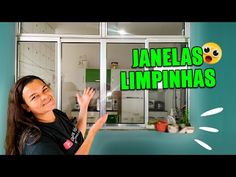 a woman standing in front of a window with the words janelas limphnas