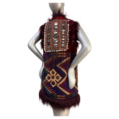 Torso Creations Merlot Mongolian Fur Bohemian Vest w Patchwork, Tassels & Mirror Applique: Back applique panel with unusually large shisha mirror panel embroidery and cowry shells. No pockets or closures. Lush and exotic beauty. US size up to 8. Bohemian Vests, Mongolian Fur, Mirror Panel, Cowry Shell, Mongolia, Merlot, Vest Jacket, Yves Saint Laurent, Lush