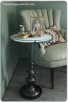 a small table with a framed photo on it