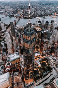 an aerial view of the skyscrapers and other buildings in new york city at dusk