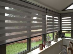 a window with blinds on the outside and inside