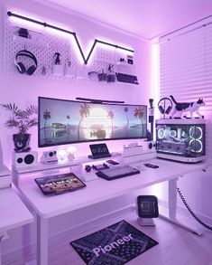 a white desk topped with two computer monitors