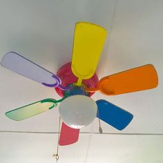 a colorful ceiling fan hanging from the ceiling