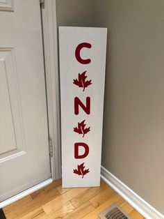 a sign that says canada on it next to a door