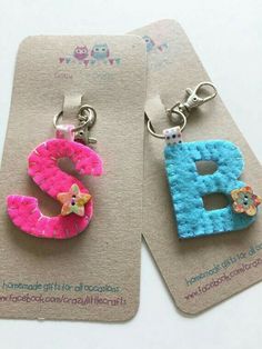 two keychains made to look like the letters b and c are decorated with felt