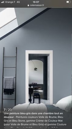 an image of a room with grey walls and white trim on the ceiling is shown